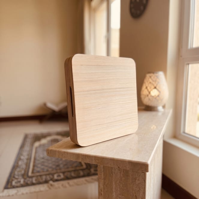 Nuur with the display off, showing the plain maple veneer face