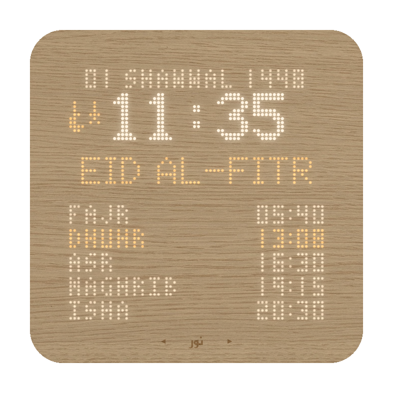 Close-up photo of the Nuur display showing all four zones: date bar, clock, banner, and prayer schedule
